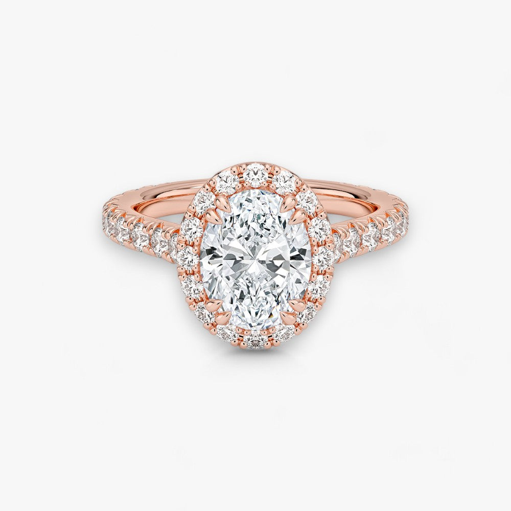 Exklusiver Diamantring aus Rosegold mit einem 2-Karat Oval LabGrown geschliffenen Diamanten, umgeben von einem eleganten Pavé-Halo-Design. Luxuriöser Verlobungsring mit brillantem Steinfunkeln und hochwertiger Handwerkskunst – perfekt für Hochzeitsanträge. Premium-Schmuck für anspruchsvolle Kunden, geeignet für besondere Anlässe.
