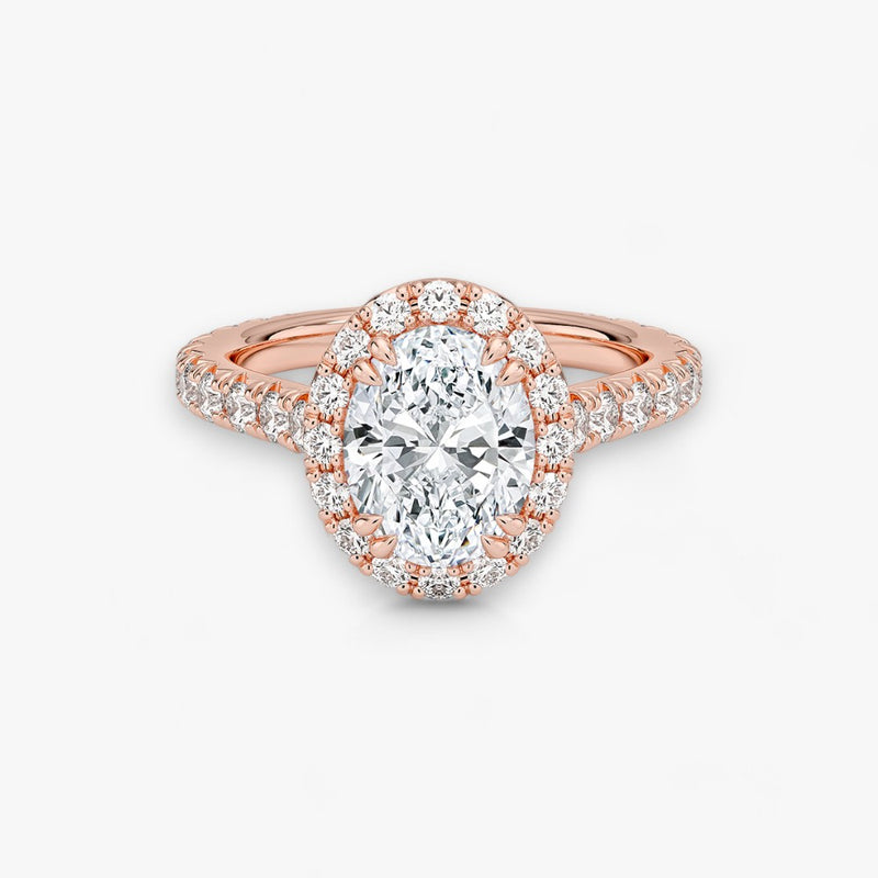 Exklusiver Diamantring aus Rosegold mit einem 2-Karat Oval LabGrown geschliffenen Diamanten, umgeben von einem eleganten Pavé-Halo-Design. Luxuriöser Verlobungsring mit brillantem Steinfunkeln und hochwertiger Handwerkskunst – perfekt für Hochzeitsanträge. Premium-Schmuck für anspruchsvolle Kunden, geeignet für besondere Anlässe.