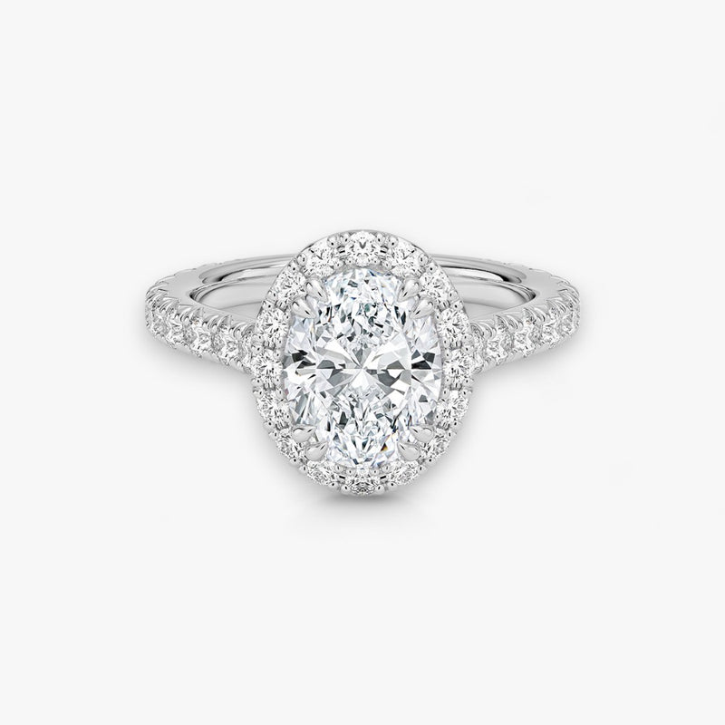 Exklusiver Diamantring aus Weissgold mit einem 2-Karat Oval LabGrown geschliffenen Diamanten, umgeben von einem eleganten Pavé-Halo-Design. Luxuriöser Verlobungsring mit brillantem Steinfunkeln und hochwertiger Handwerkskunst – perfekt für Hochzeitsanträge. Premium-Schmuck für anspruchsvolle Kunden, geeignet für besondere Anlässe.