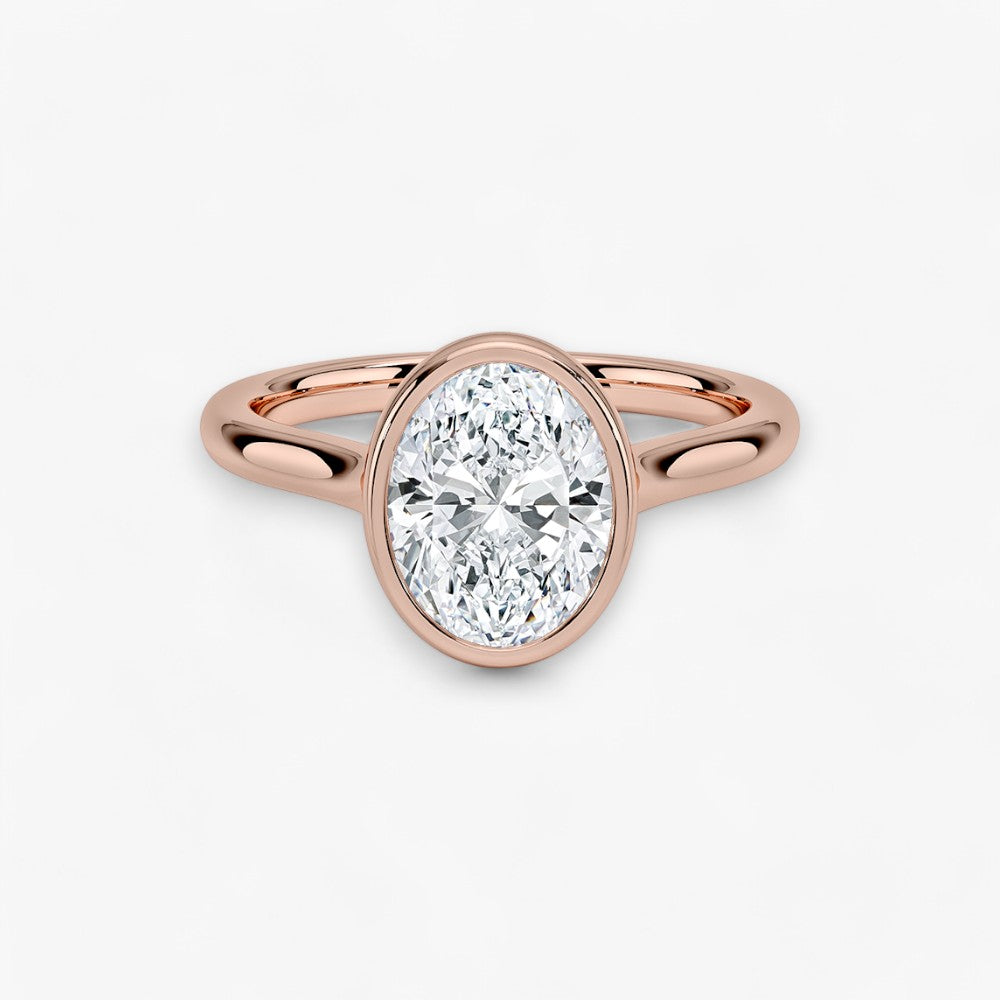 Moderner Verlobungsring mit 2-Karat Oval-Cut-Diamant in einer stilvollen Zargenfassung aus hochwertigem Rosegold. Minimalistisches Schmuckdesign mit luxuriösem Glanz und zeitloser Eleganz, ideal für Verlobung, Hochzeit oder Jubiläum. Exklusiver Diamantring, der Handwerkskunst und modernes Design vereint. Jetzt den perfekten Verlobungsring für besondere Momente online entdecken und kaufen.