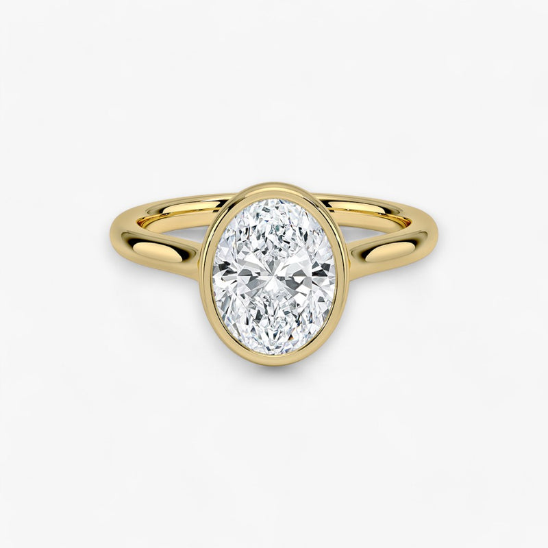 Moderner Verlobungsring mit 2-Karat Oval-Cut-Diamant in einer stilvollen Zargenfassung aus hochwertigem Gelbgold. Minimalistisches Schmuckdesign mit luxuriösem Glanz und zeitloser Eleganz, ideal für Verlobung, Hochzeit oder Jubiläum. Exklusiver Diamantring, der Handwerkskunst und modernes Design vereint. Jetzt den perfekten Verlobungsring für besondere Momente online entdecken und kaufen.