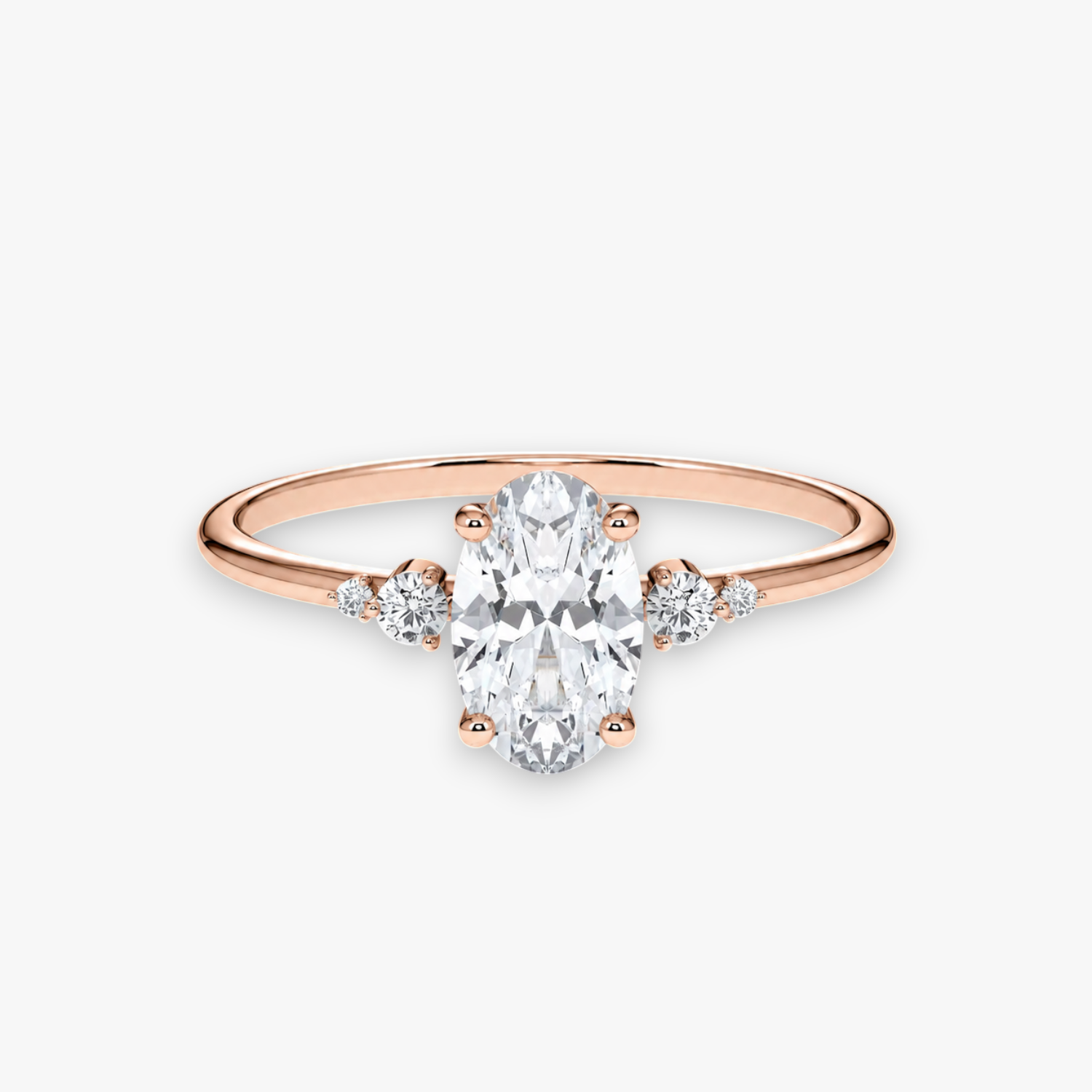 CASCADE Verlobungsring aus Roségold mit ovalem Diamant-Solitär und abgestuften Seitensteinen – Produktansicht von NÓIR Diamonds