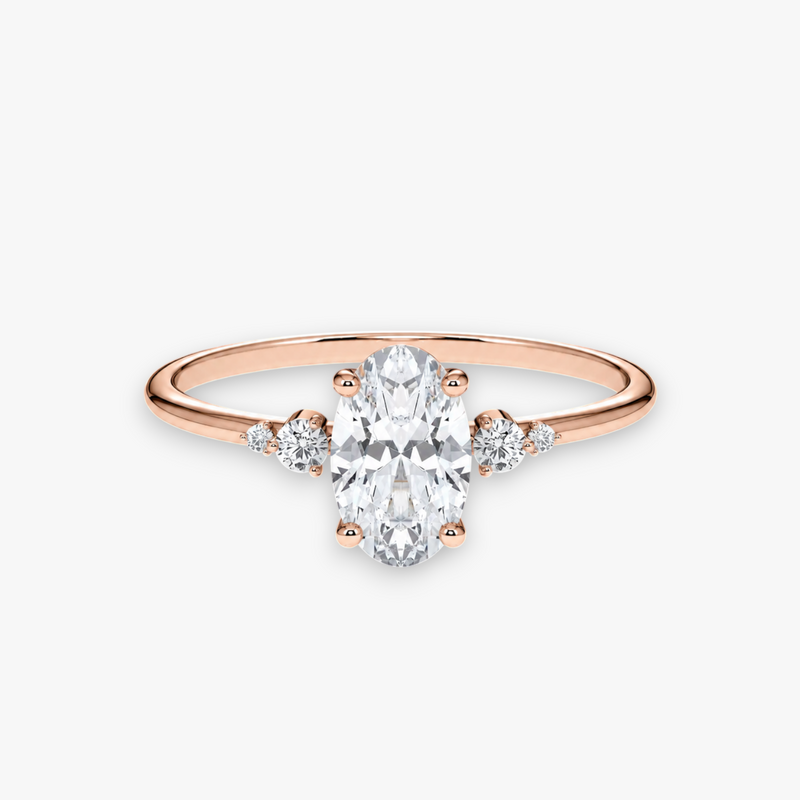 CASCADE Verlobungsring aus Roségold mit ovalem Diamant-Solitär und abgestuften Seitensteinen – Produktansicht von NÓIR Diamonds
