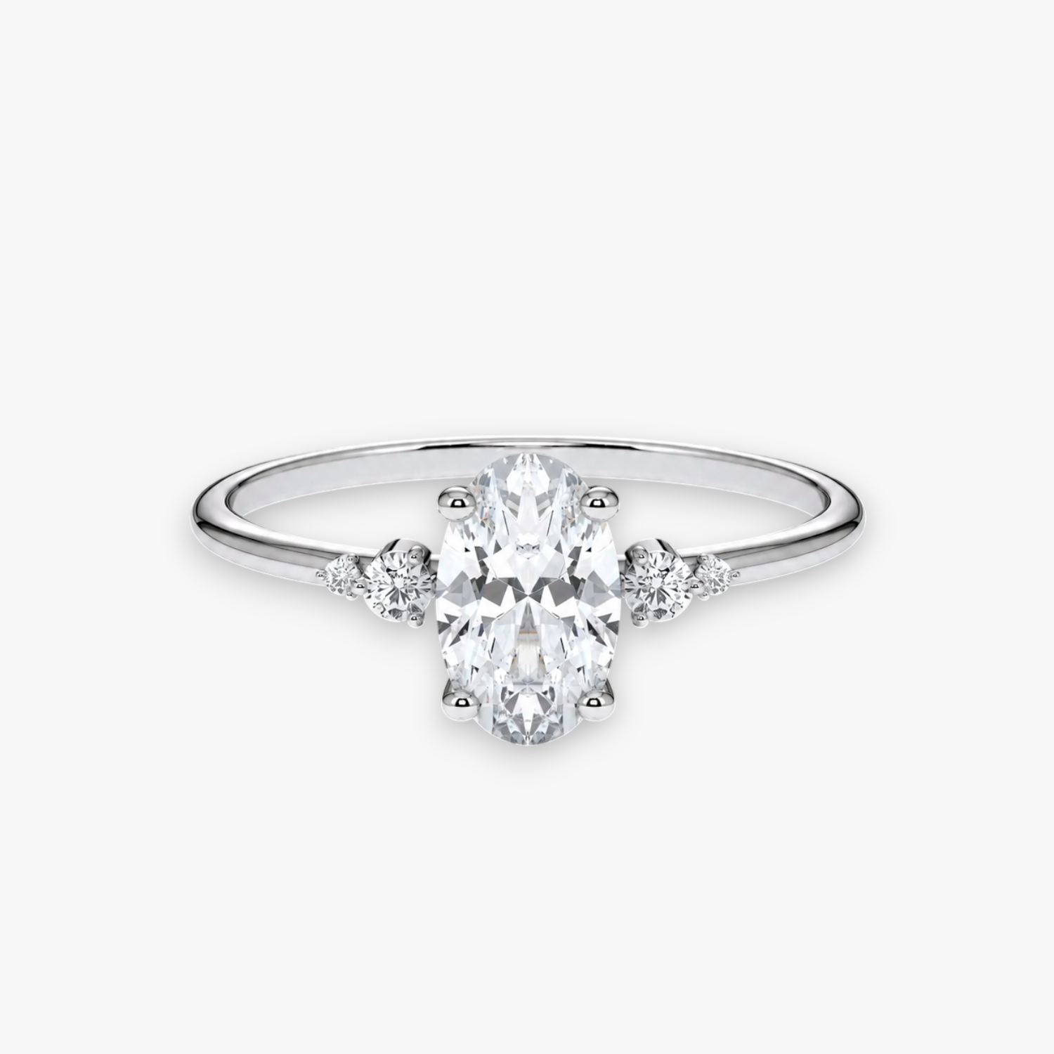 CASCADE Verlobungsring in Weissgold bzw. Platin mit ovalem Diamant-Solitär und abgestuften Seitensteinen – Produktansicht von NÓIR Diamonds