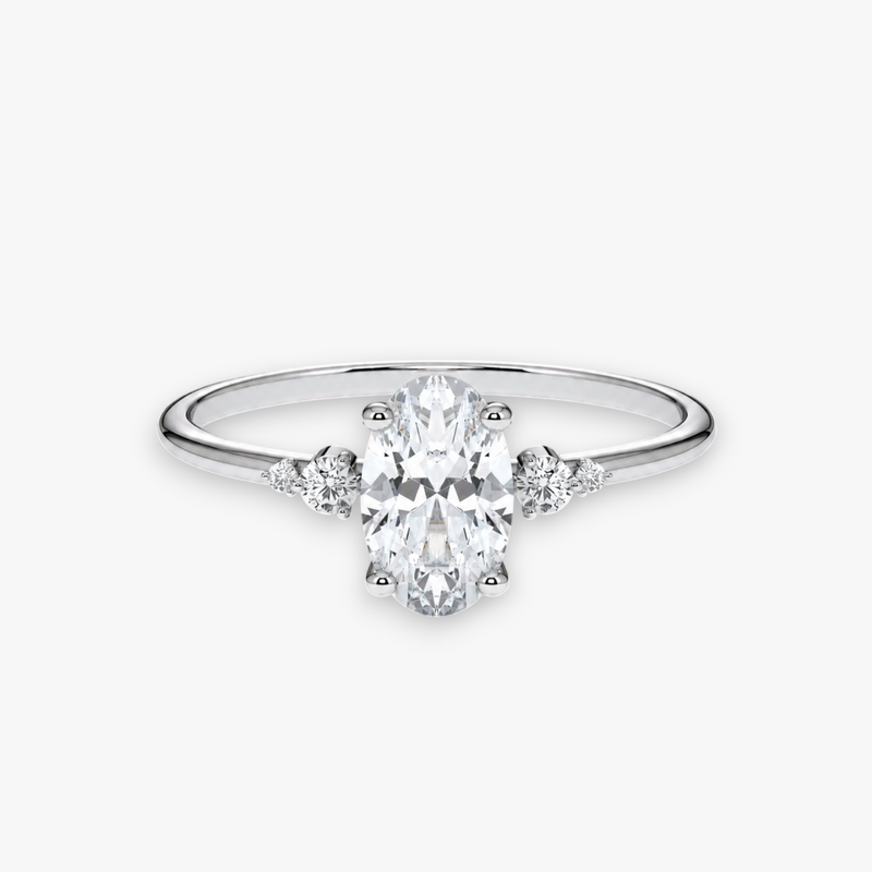CASCADE Verlobungsring in Weissgold bzw. Platin mit ovalem Diamant-Solitär und abgestuften Seitensteinen – Produktansicht von NÓIR Diamonds