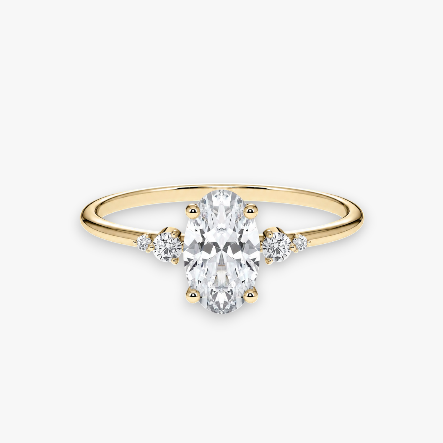 CASCADE Verlobungsring aus Gelbgold mit ovalem Diamant-Solitär und abgestuften Seitensteinen – Produktansicht von NÓIR Diamonds