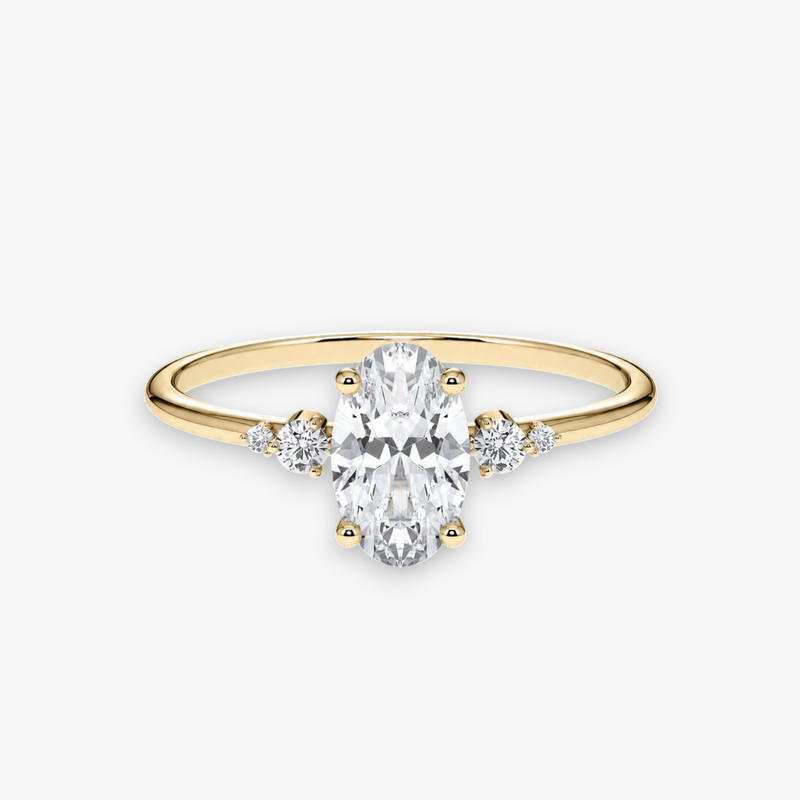 CASCADE Verlobungsring aus Gelbgold mit ovalem Diamant-Solitär und abgestuften Seitensteinen – Produktansicht von NÓIR Diamonds