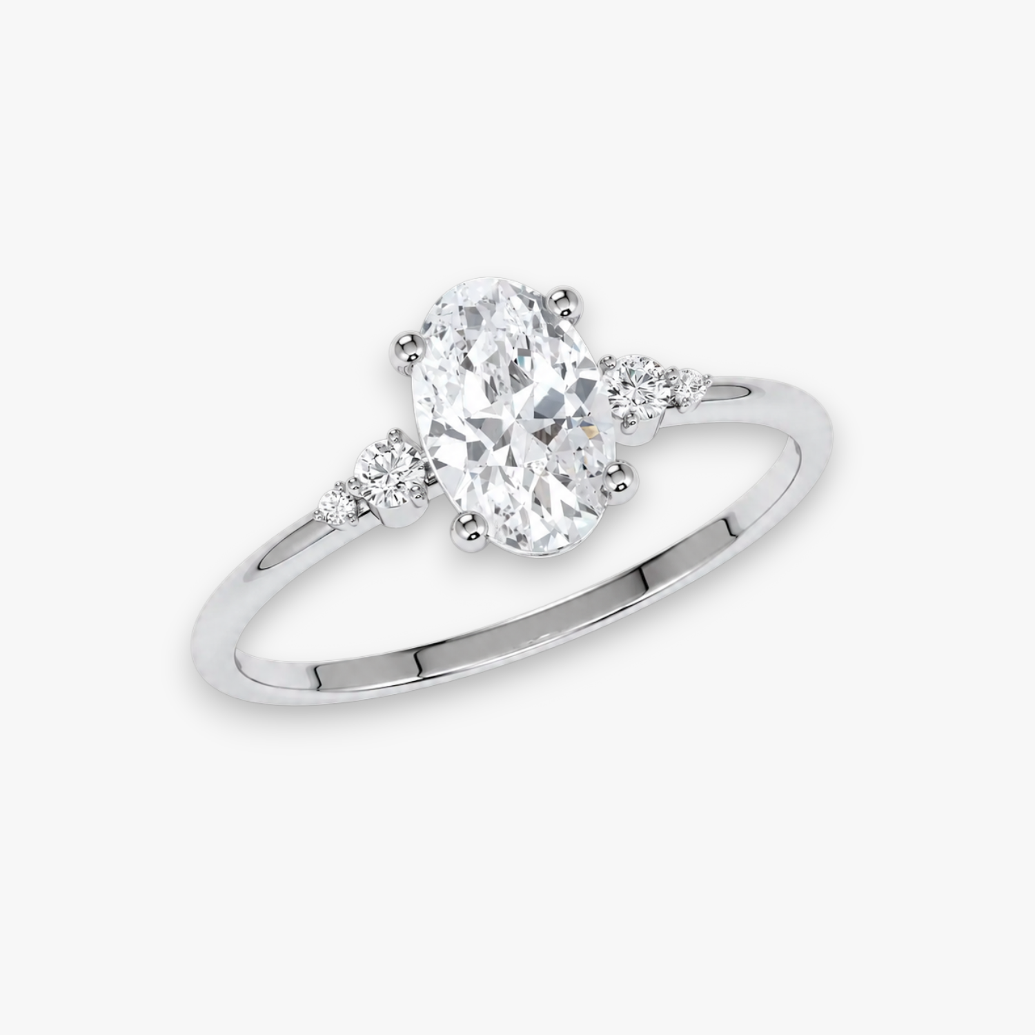 Verlobungsring CASCADE in Weissgold bzw. Platin – ovaler Diamant im Zentrum, flankiert von abgestuften Seitendiamanten