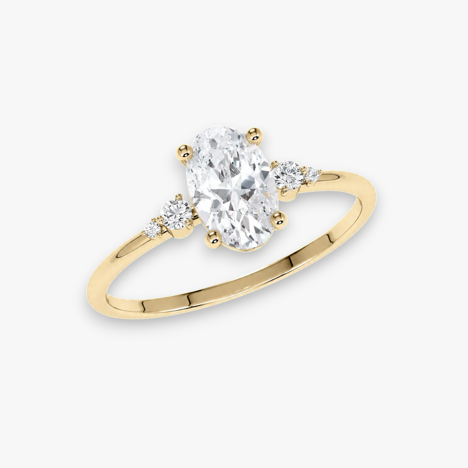 Gelbgold Verlobungsring CASCADE – ovaler Diamant im Zentrum, flankiert von abgestuften Seitendiamanten