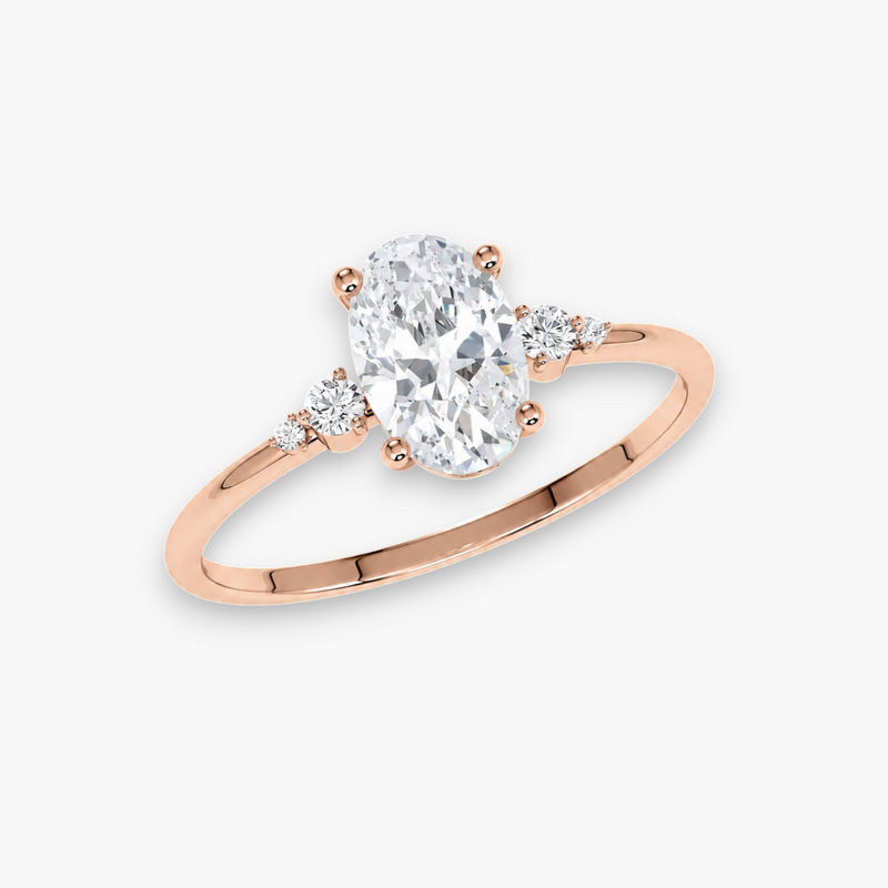 Roségold Verlobungsring CASCADE – ovaler Diamant im Zentrum, flankiert von abgestuften Seitendiamanten