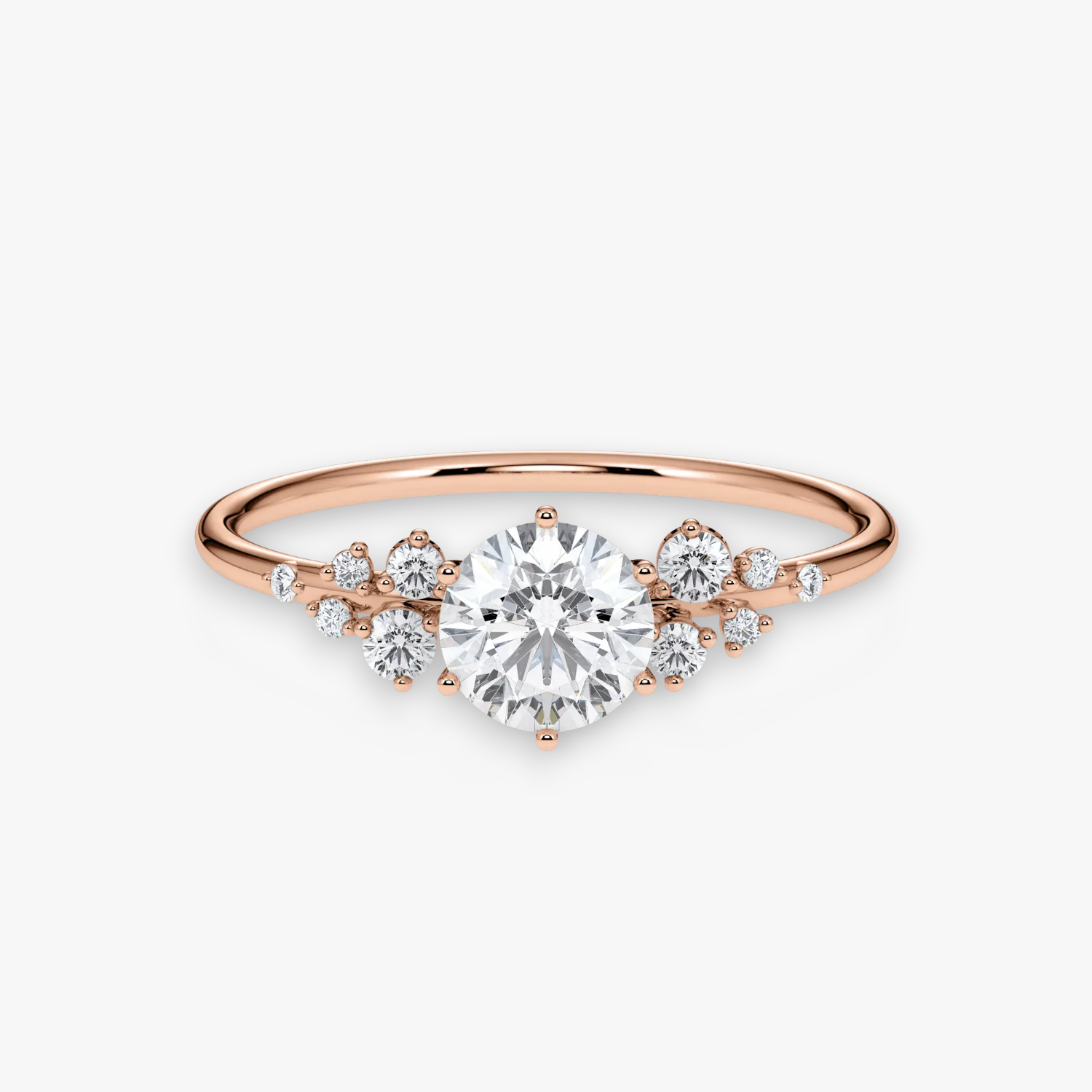 STARLIGHT Verlobungsring aus Roségold mit rundem Diamant-Solitär und funkelndem Diamant-Cluster – Frontalansicht von NÓIR Diamonds